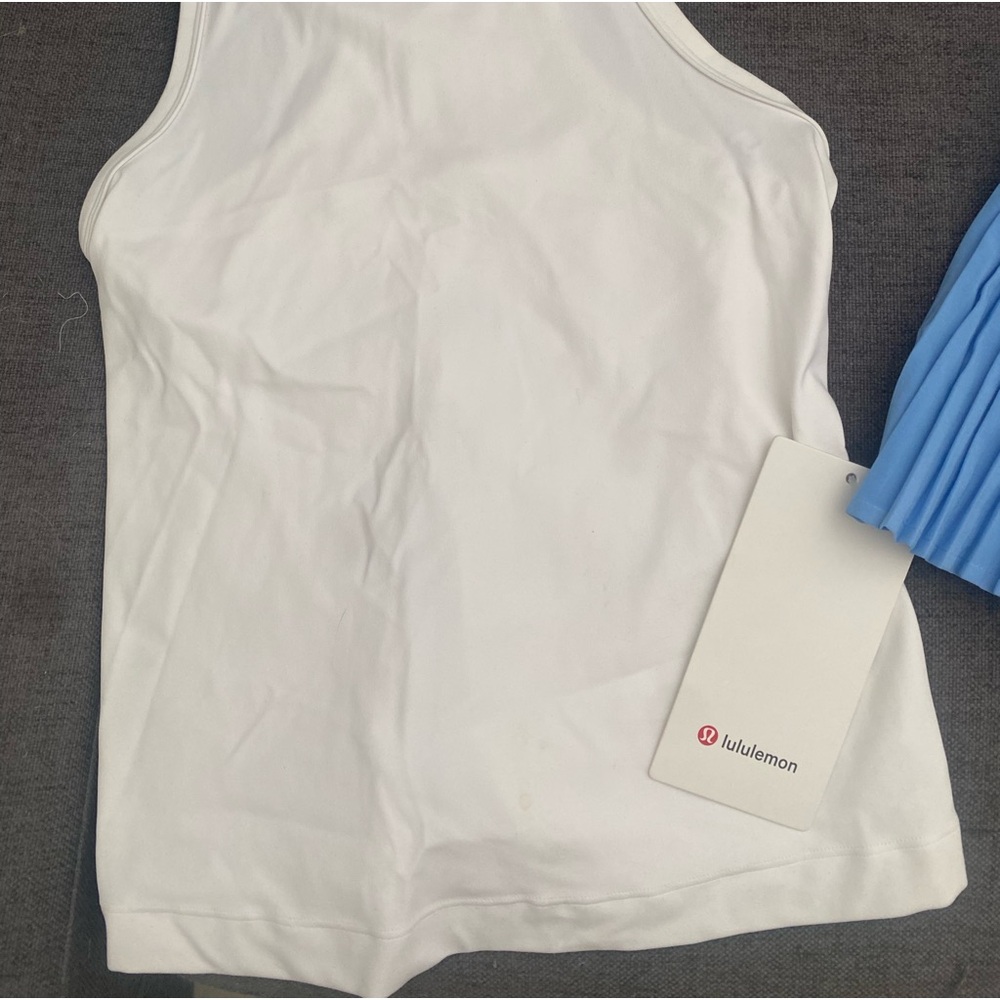 LuluLemon Racer back top and pleated skirt. New with tags. Size 4.